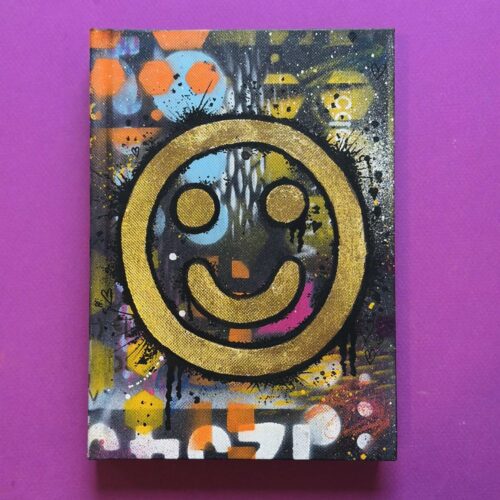 Shop item. Happy tears sketch book. Cover with spray paint and a gold leaf smiley face. £45